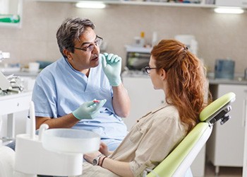 Patient in Melbourne talking to endodontist about a root canal