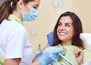 Patient in Melbourne talking to endodontist about a root canal or extraction