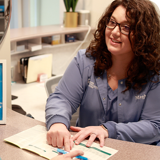 Melbourne dental team member talking to a patient