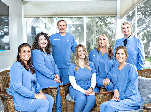 Associated Endodontists of Melbourne team members smiling in office